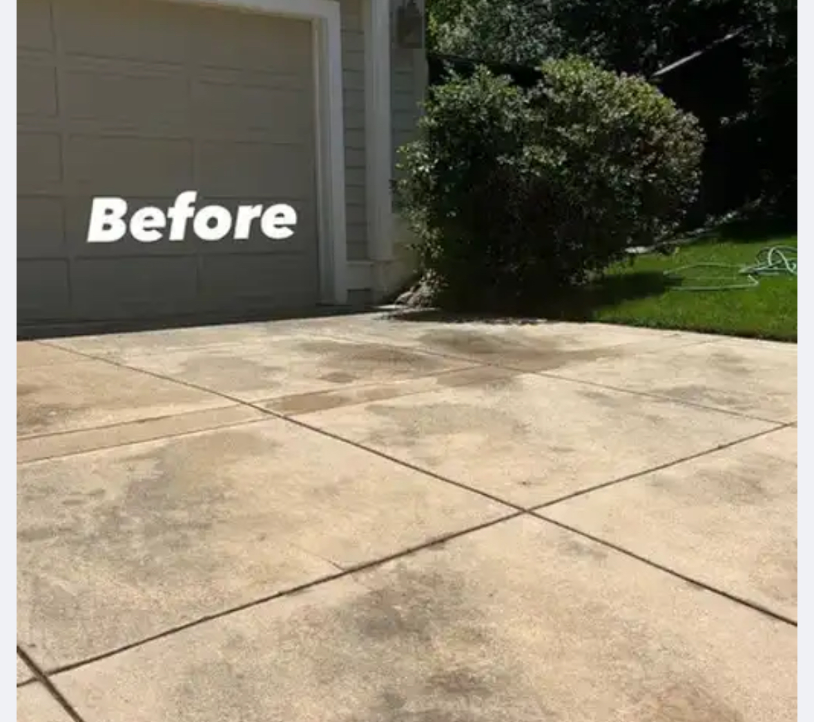 Driveway before cleaning - heavily stained concrete with oil spots and years of buildup