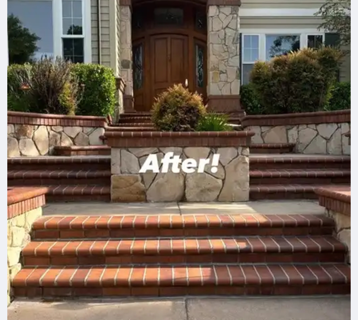 Stone and brick retaining wall after cleaning - restored to vibrant, clean condition