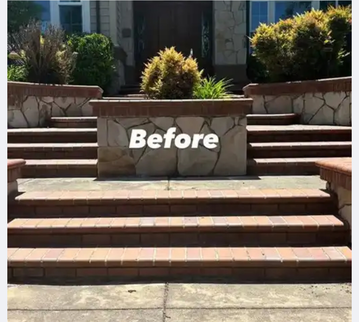 Stone and brick retaining wall before cleaning - weathered and stained surfaces